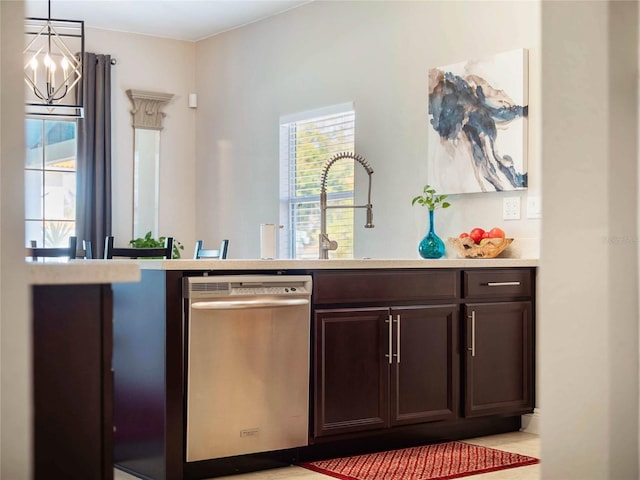 bar with a wealth of natural light, pendant lighting, dishwasher, and a sink