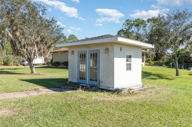 view of outbuilding featuring french doors