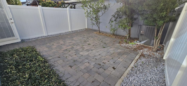 view of patio / terrace with fence and cooling unit