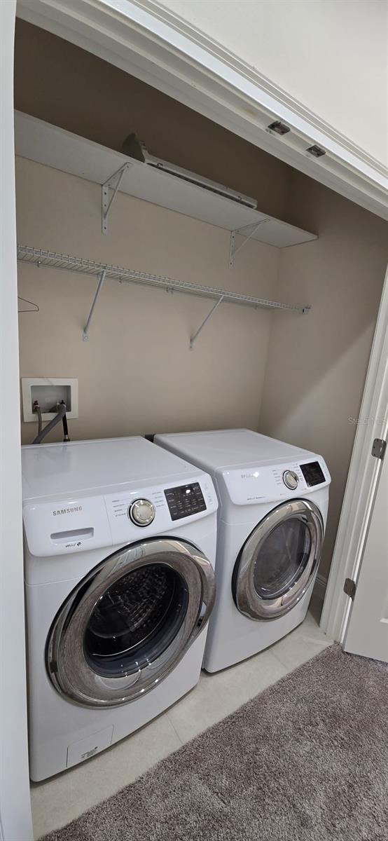 clothes washing area featuring laundry area and independent washer and dryer