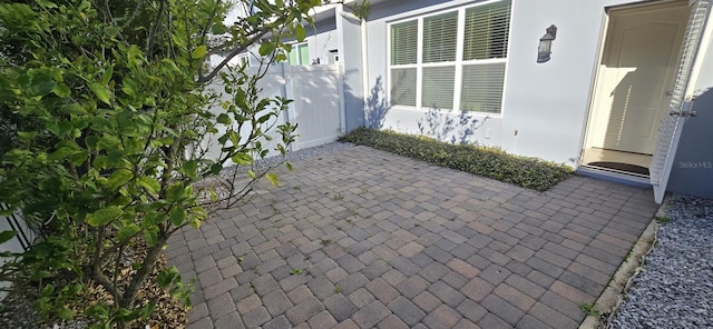 view of patio / terrace featuring fence