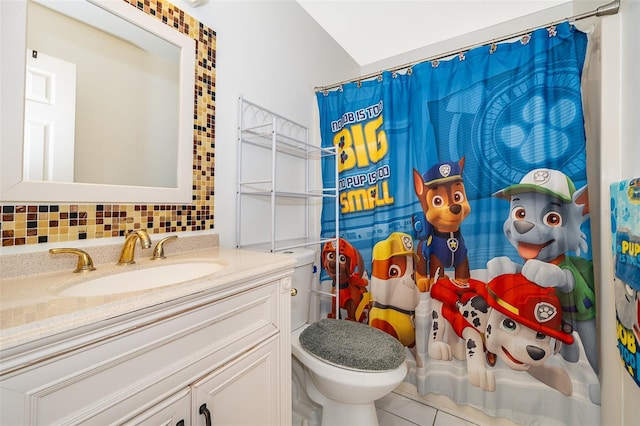 bathroom with a shower with shower curtain, backsplash, vanity, and tile patterned flooring