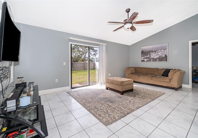 living room featuring light tile patterned floors, baseboards, ceiling fan, and vaulted ceiling