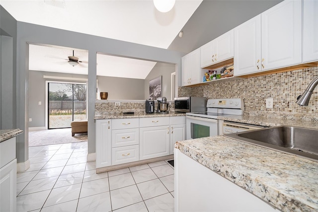 kitchen with stainless steel microwave, backsplash, ceiling fan, white electric stove, and a sink