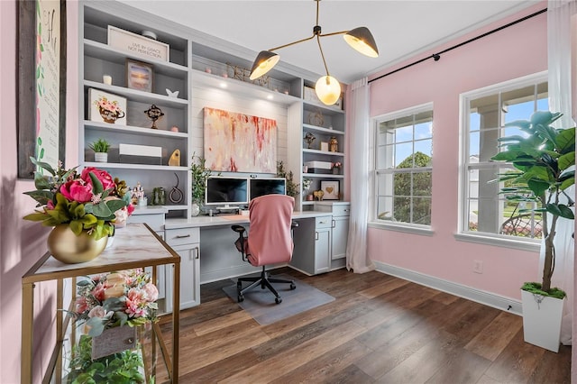 home office with dark wood-style floors, baseboards, and built in study area