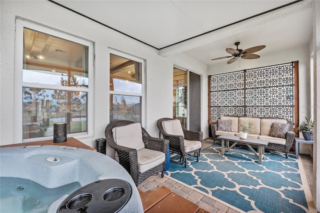 sunroom with ceiling fan