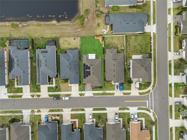 birds eye view of property with a residential view