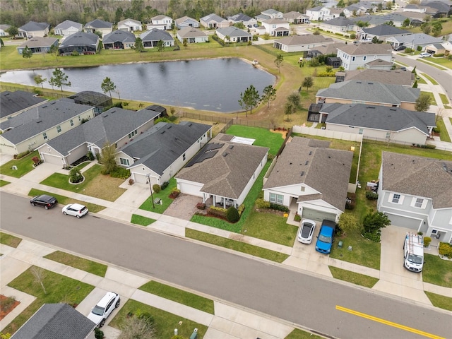 bird's eye view with a water view and a residential view