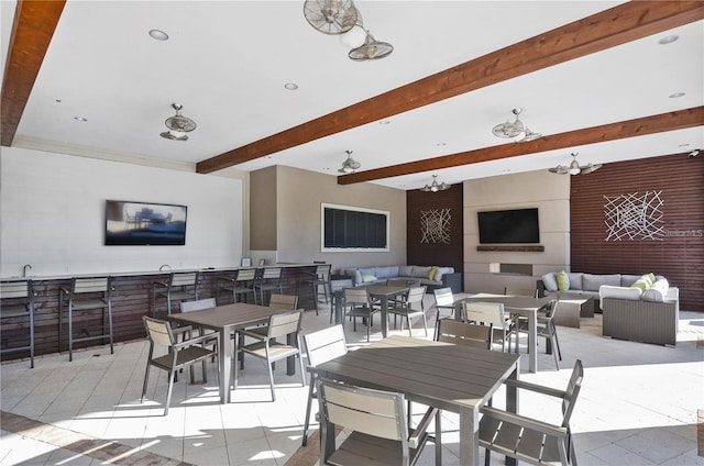 view of patio / terrace featuring an outdoor hangout area, outdoor dining area, and outdoor wet bar