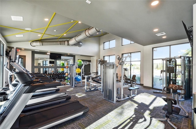 gym with high vaulted ceiling, visible vents, carpet flooring, and recessed lighting