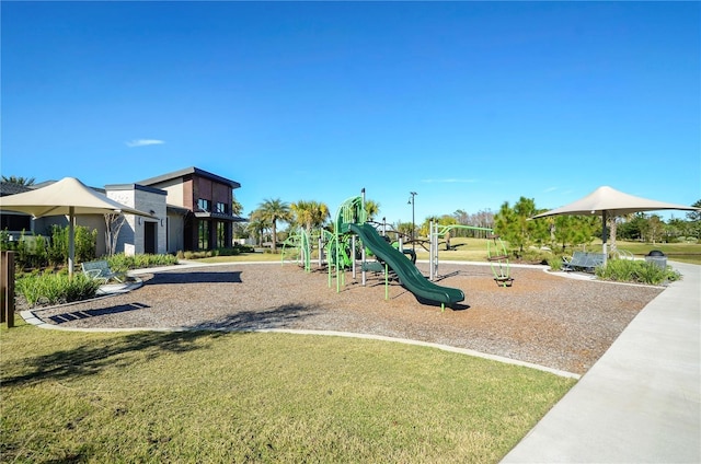 community playground featuring a lawn