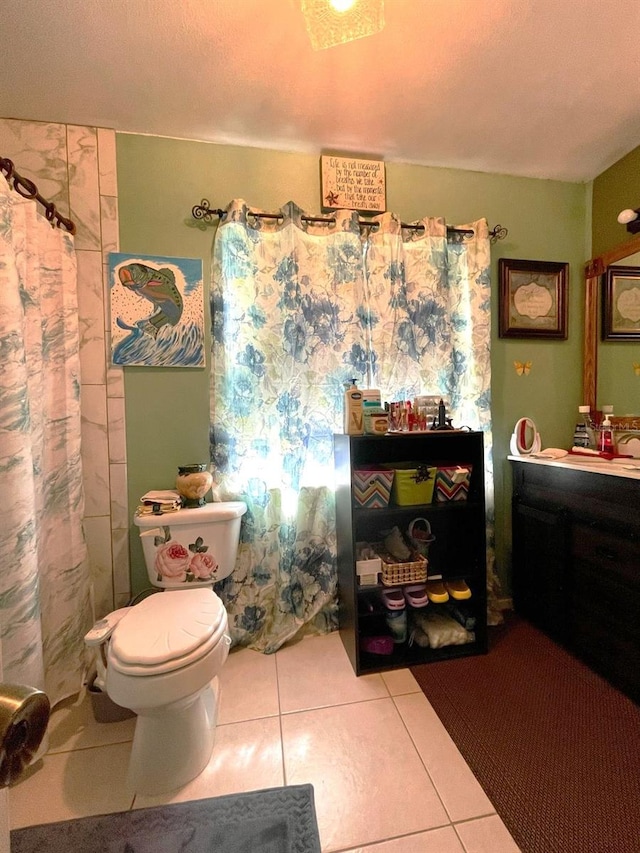 full bath featuring toilet, tile patterned flooring, vanity, and a shower with curtain