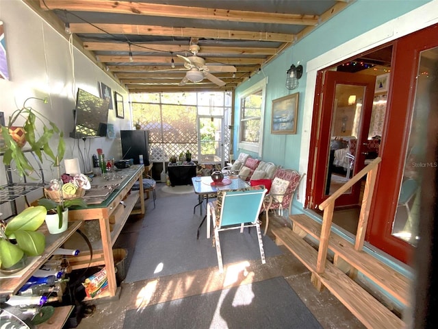 sunroom featuring beamed ceiling