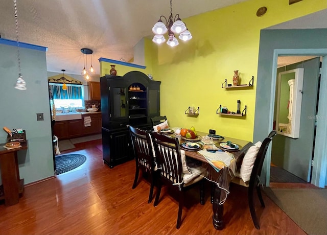 11213 River Grove Dr, Orlando, FL 32817 - dining space with wood finished floors and a chandelier