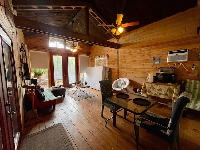 11213 River Grove Dr, Orlando, FL 32817 - dining space featuring french doors, wooden walls, wood-type flooring, vaulted ceiling, and a ceiling fan