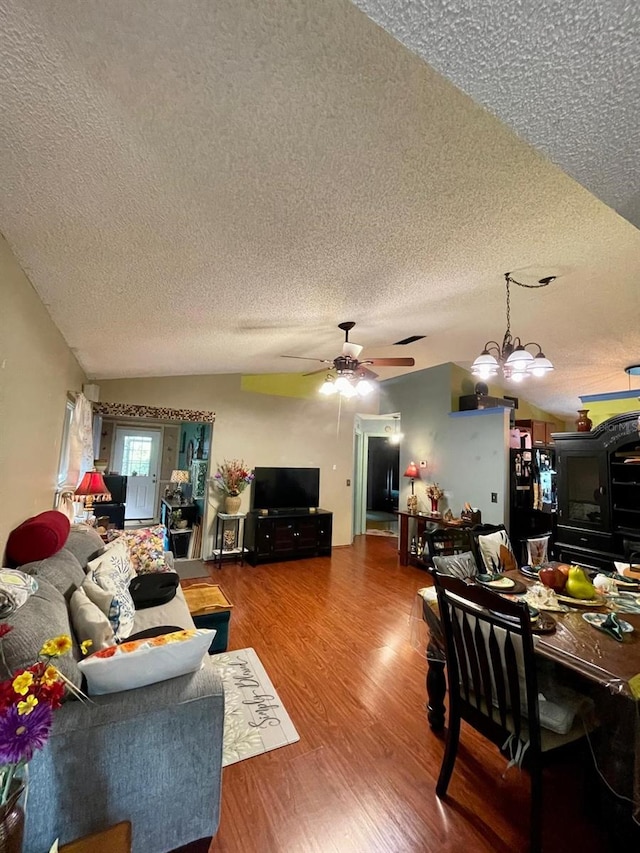 11213 River Grove Dr, Orlando, FL 32817 - living room featuring a textured ceiling, wood finished floors, ceiling fan, and a chandelier