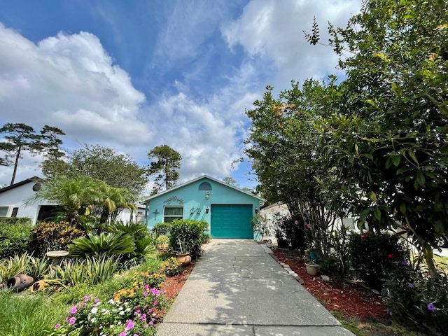 11213 River Grove Dr, Orlando, FL 32817 - view of front facade with driveway, stucco siding, and an attached garage