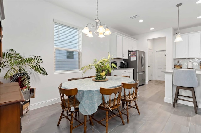 dining space with recessed lighting, visible vents, baseboards, and an inviting chandelier