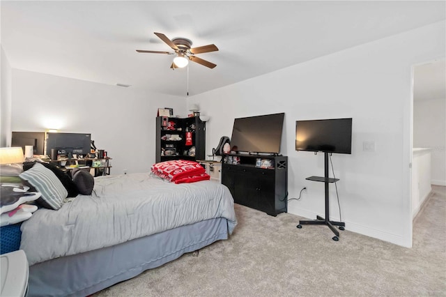 bedroom with carpet floors, baseboards, and a ceiling fan