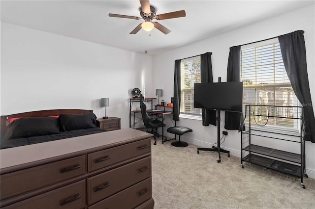 bedroom featuring light carpet and baseboards