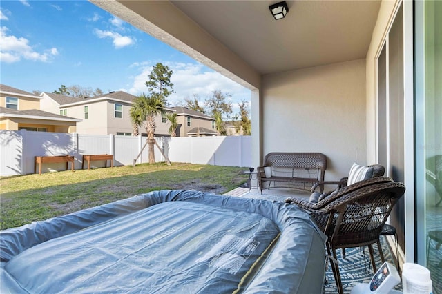 view of patio / terrace with outdoor lounge area, a fenced backyard, and a residential view