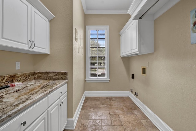 laundry area with cabinet space, baseboards, gas dryer hookup, ornamental molding, and hookup for a washing machine