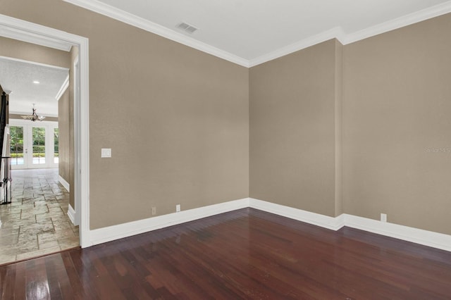 unfurnished room featuring ornamental molding, french doors, visible vents, and wood finished floors