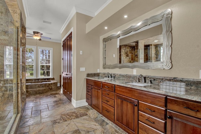 bathroom with crown molding, double vanity, a sink, and stone tile floors