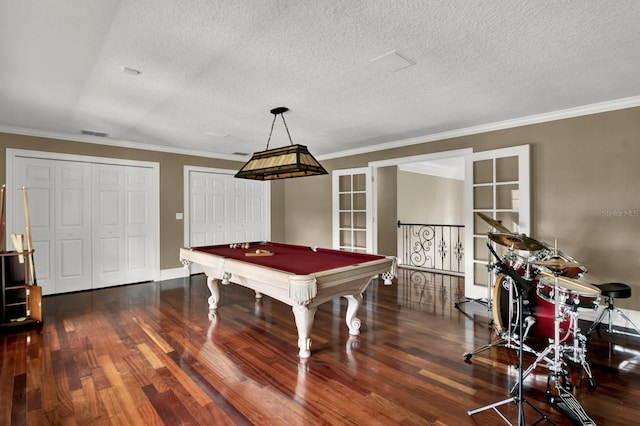 recreation room with pool table, visible vents, ornamental molding, a textured ceiling, and wood finished floors