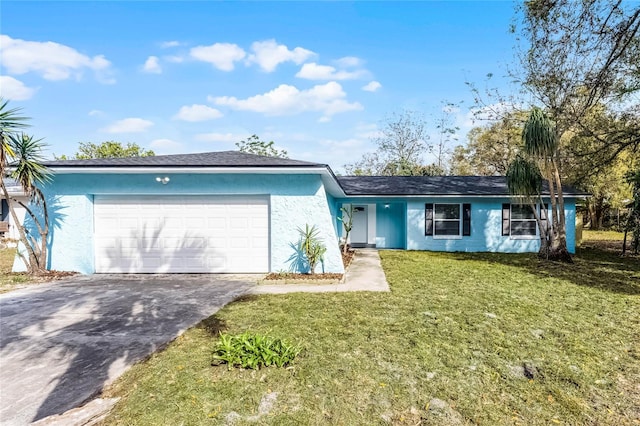 ranch-style house with concrete driveway, a front lawn, an attached garage, and stucco siding