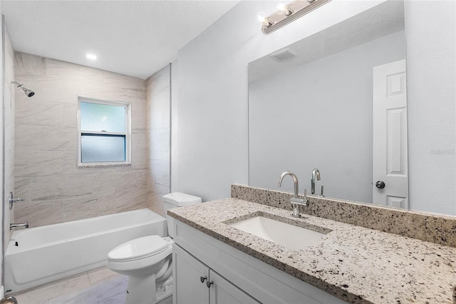 bathroom with washtub / shower combination, visible vents, vanity, and toilet