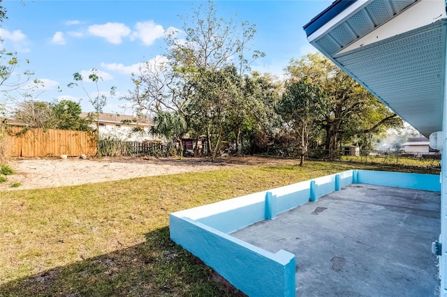 view of yard with fence and a patio