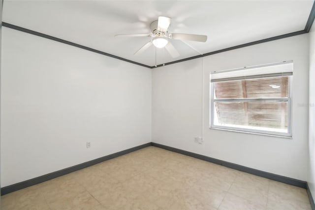 unfurnished room featuring baseboards, ornamental molding, and ceiling fan