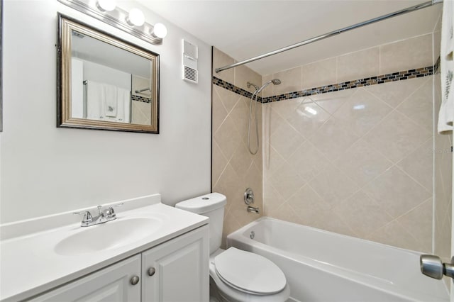 full bath featuring visible vents, vanity, toilet, and tub / shower combination