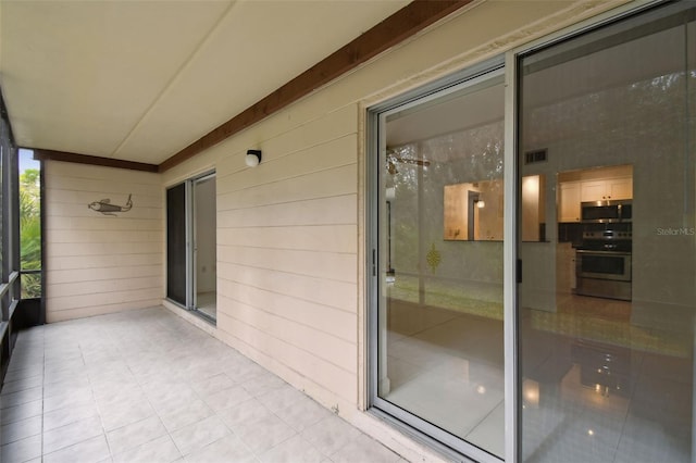 unfurnished sunroom featuring visible vents