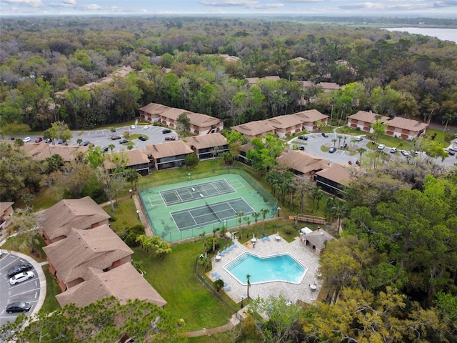 drone / aerial view featuring a view of trees