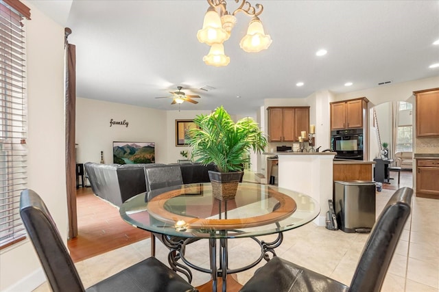 dining room with recessed lighting, visible vents, plenty of natural light, and ceiling fan with notable chandelier