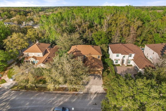 bird's eye view featuring a residential view and a forest view