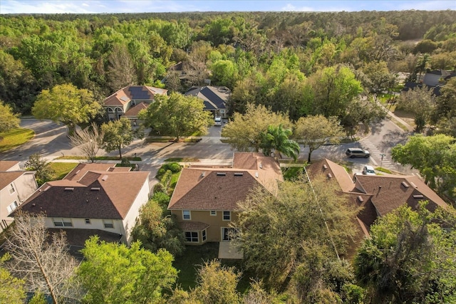 bird's eye view with a forest view and a residential view