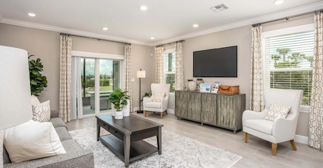 interior space with baseboards, visible vents, crown molding, and recessed lighting