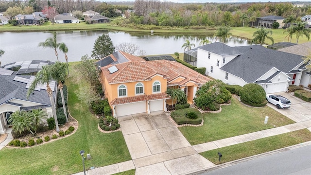 bird's eye view featuring a water view and a residential view