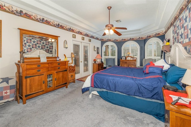 carpeted bedroom with ceiling fan, visible vents, access to outside, french doors, and a raised ceiling