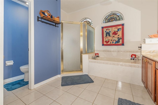 bathroom featuring tile patterned flooring, vanity, ornamental molding, a bath, and a stall shower