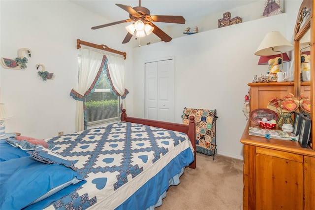 bedroom with light carpet, ceiling fan, a closet, and baseboards