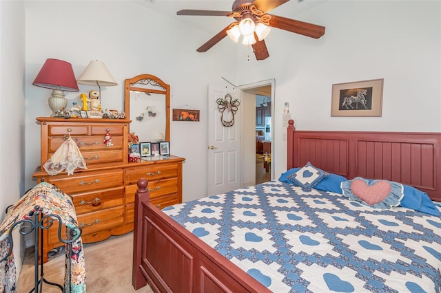 bedroom with a ceiling fan and light colored carpet