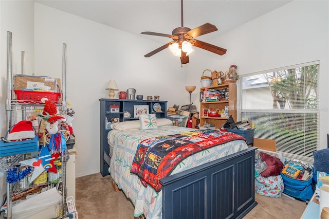 bedroom featuring light colored carpet and ceiling fan