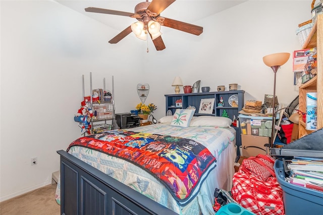 bedroom featuring light carpet, ceiling fan, and baseboards