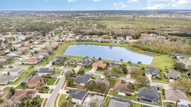 birds eye view of property with a residential view and a water view