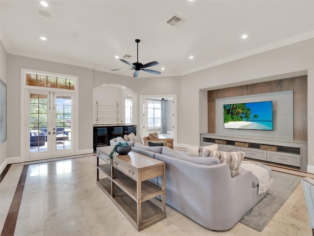 living area featuring a wealth of natural light, visible vents, and recessed lighting