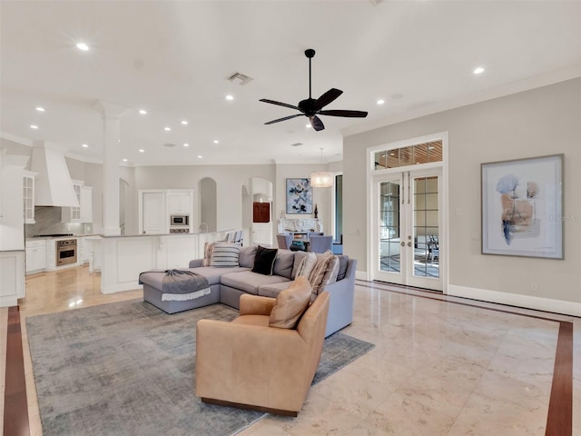 living room featuring recessed lighting, french doors, visible vents, and arched walkways